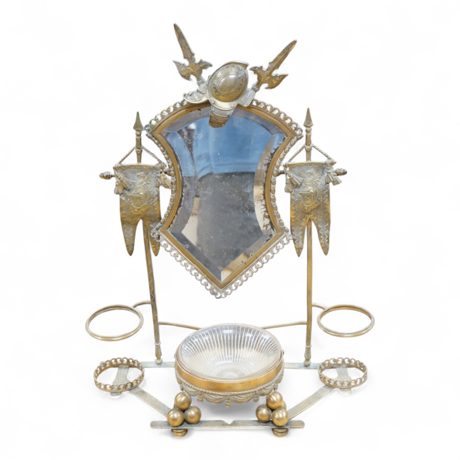 A gilt metal 'trophies' stand with mirror and glass liner, 49cm high